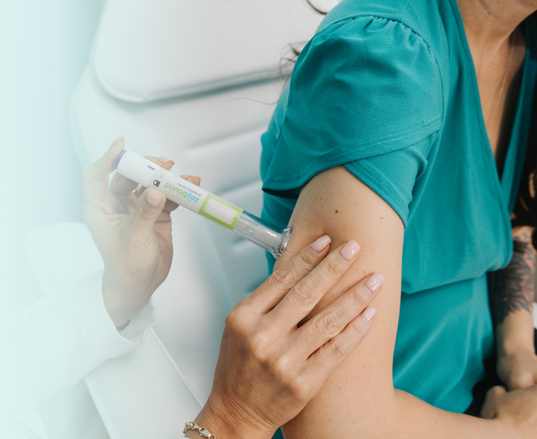 Medical professional administering medication to a patient